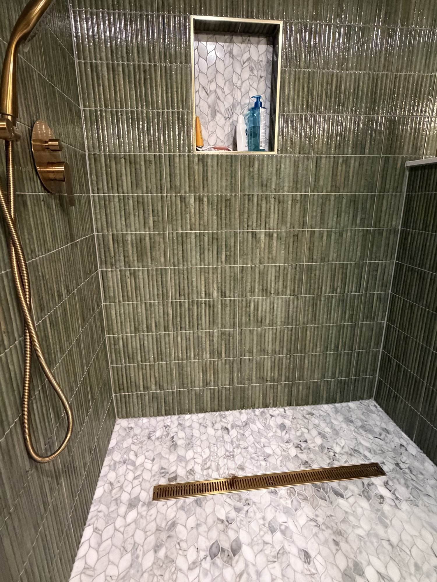 Marble mosaic shower floor with linear drain