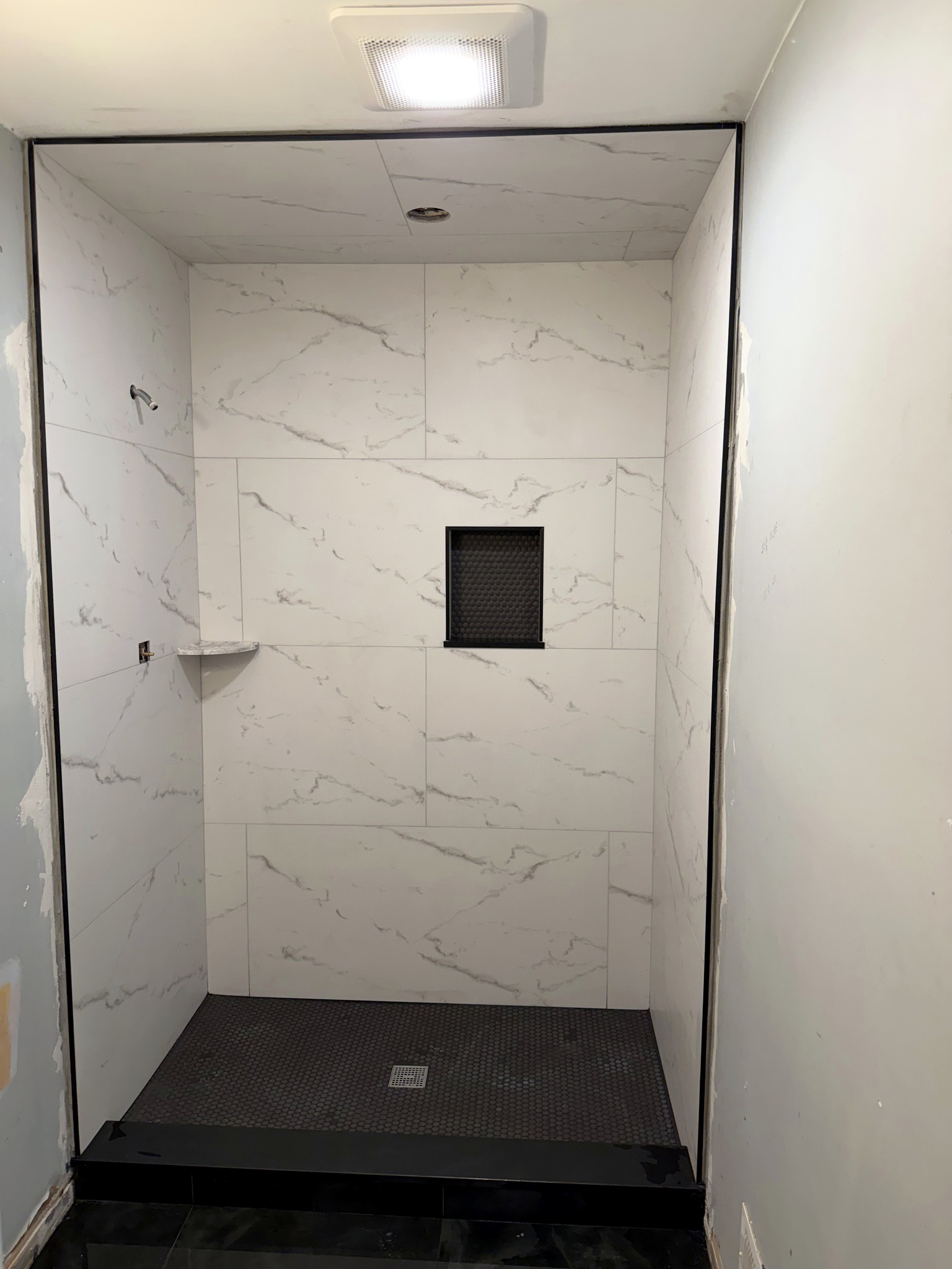 Penny tile bathroom build-out by IAC