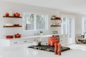 Kitchen island with pendant lights and hardwood floors